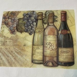 TEMPERED GLASS THREE BOTTLES OF WINE PLUS BUNCH OF GRAPES CUTTING BOARD